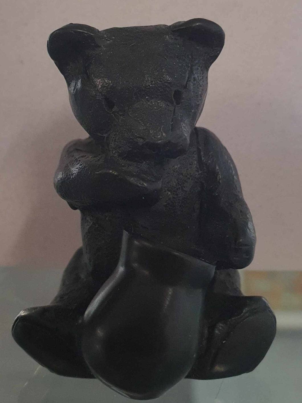 Black Teddy with honey pot.
