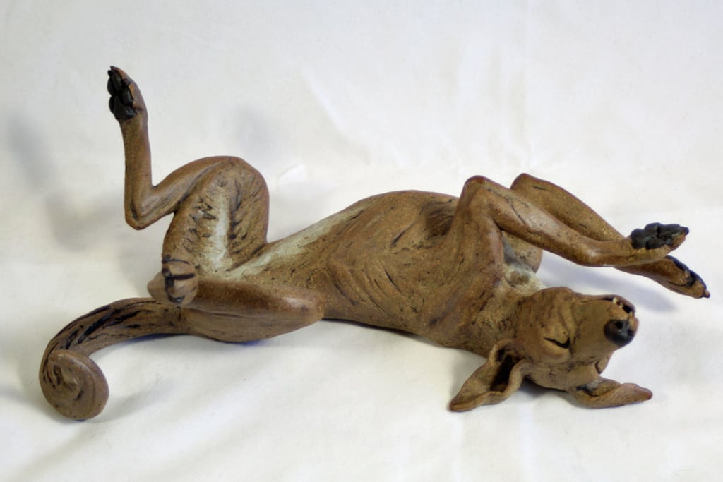 Legs up dog Ceramic by Pippa Hill